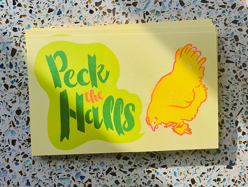 Holiday card with chicken that says peck the halls